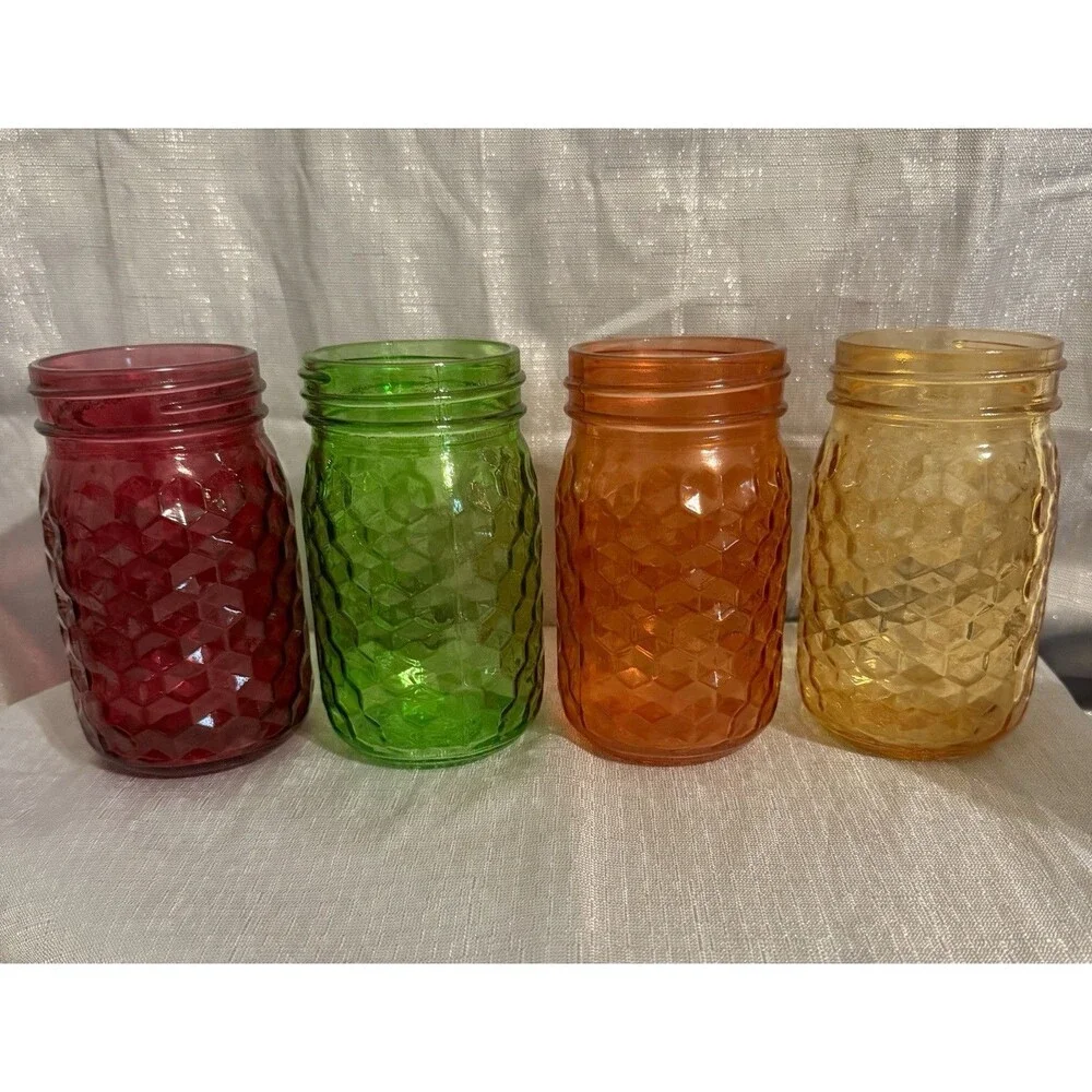 Set of 4 modern, colorful glass jars w/ hexagon stamped pattern
